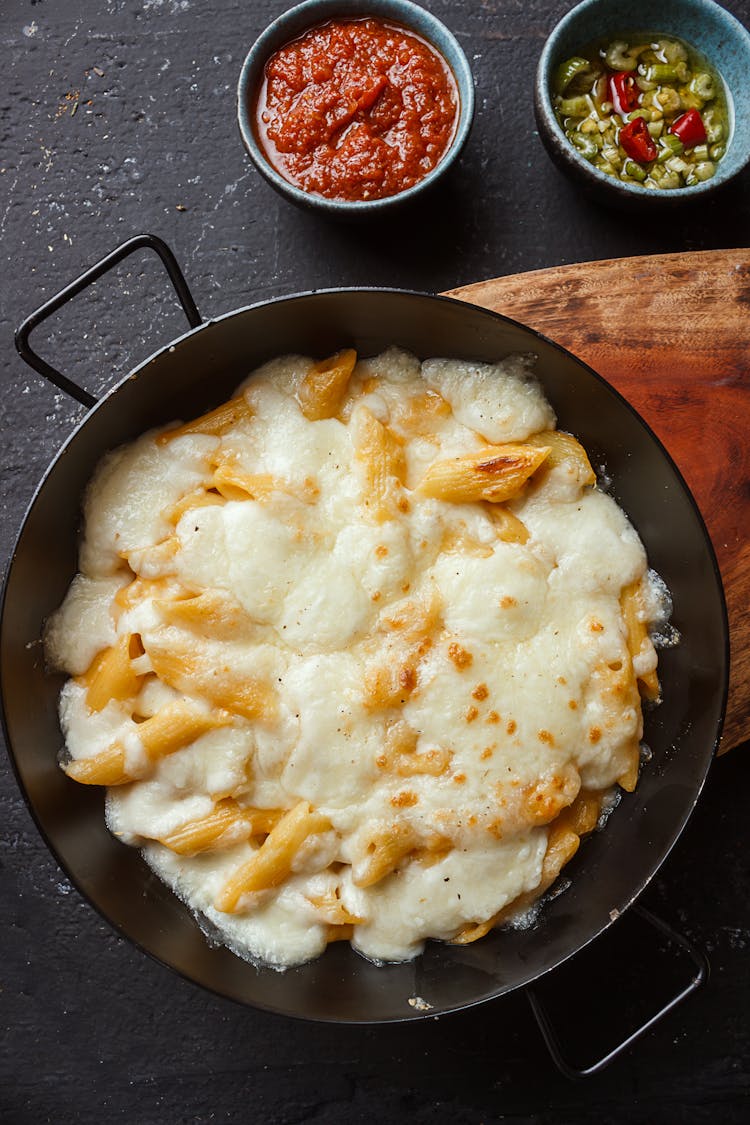 Appetizing Penne Pasta With Processed Cheese Near Sauces