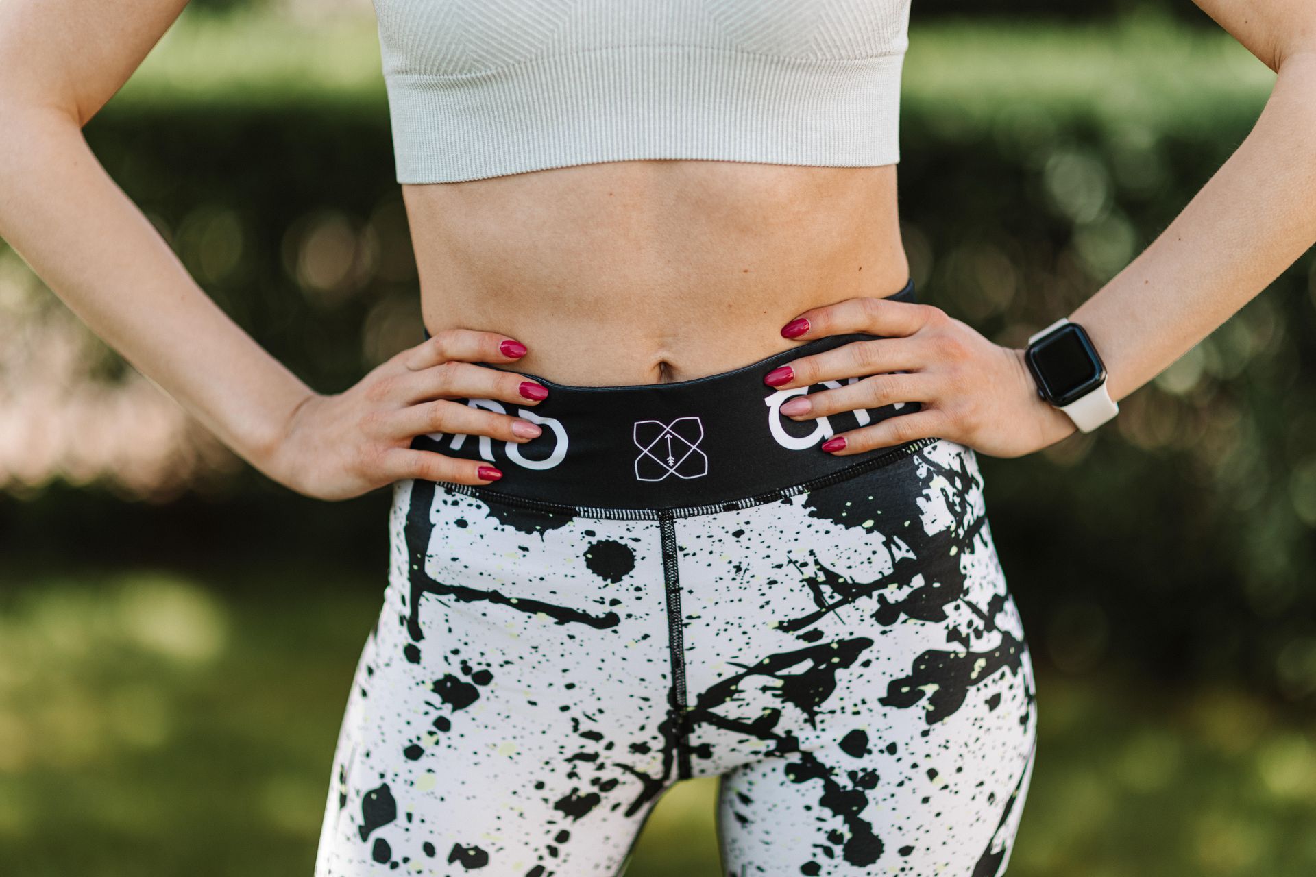 Woman in Crop Top and Leggings Wearing a Smartwatch