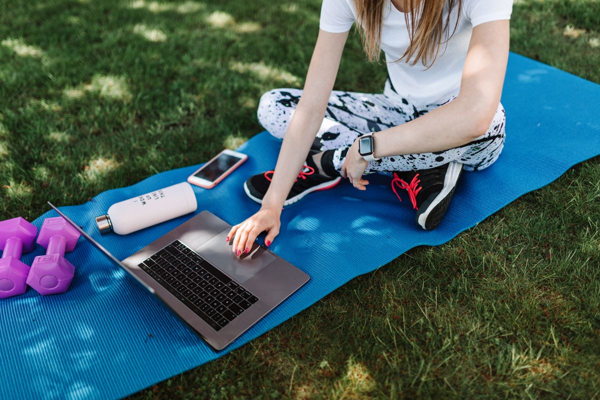 A trainer preparing course content and narration on a computer