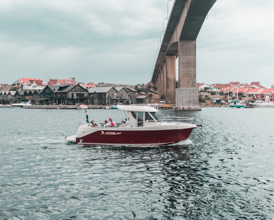 A Motorboat Passing Under the Bridge