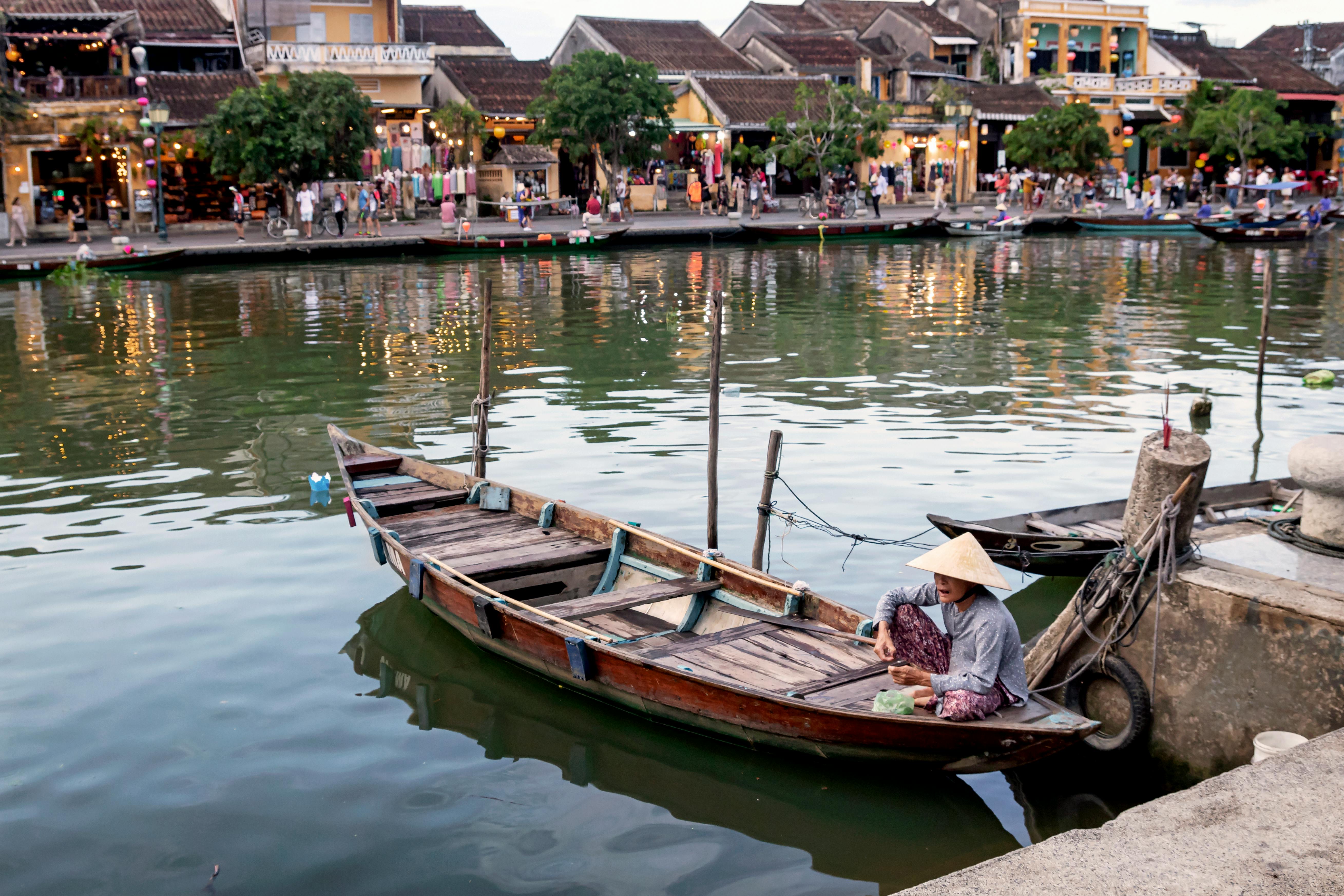 Free A Boatman on His Boat in a River Stock Photo