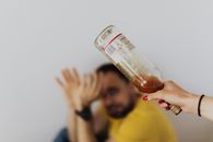 A Person Holding a Bottle