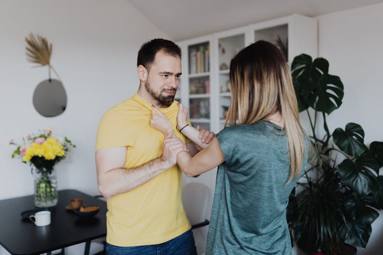 Woman Grabbing Man By Shirt