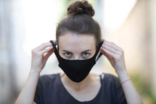 Free Woman in Black Shirt Wearing a Black Face Mask Stock Photo
