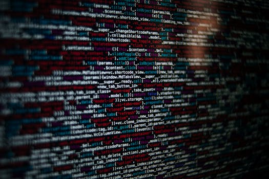 Detailed image of computer source code displayed on a screen, showcasing web development elements.
