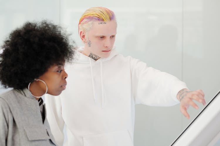 A Man With Colorful Hair In White Pullover Hoodie