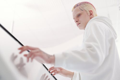 A Man Using a Touchscreen Device