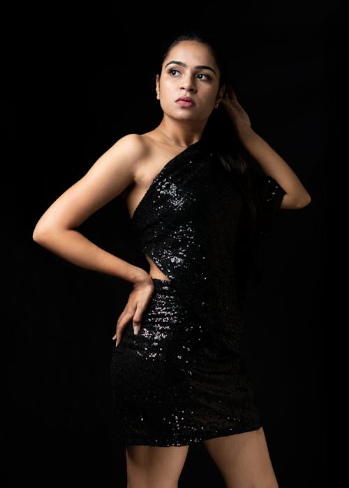 Free Woman in elegant black dress in studio Stock Photo
