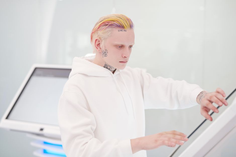 User interacting with a touch-sensitive mirror interface - led smart mirror User interacting with a touch-sensitive mirror interface - led smart mirror
