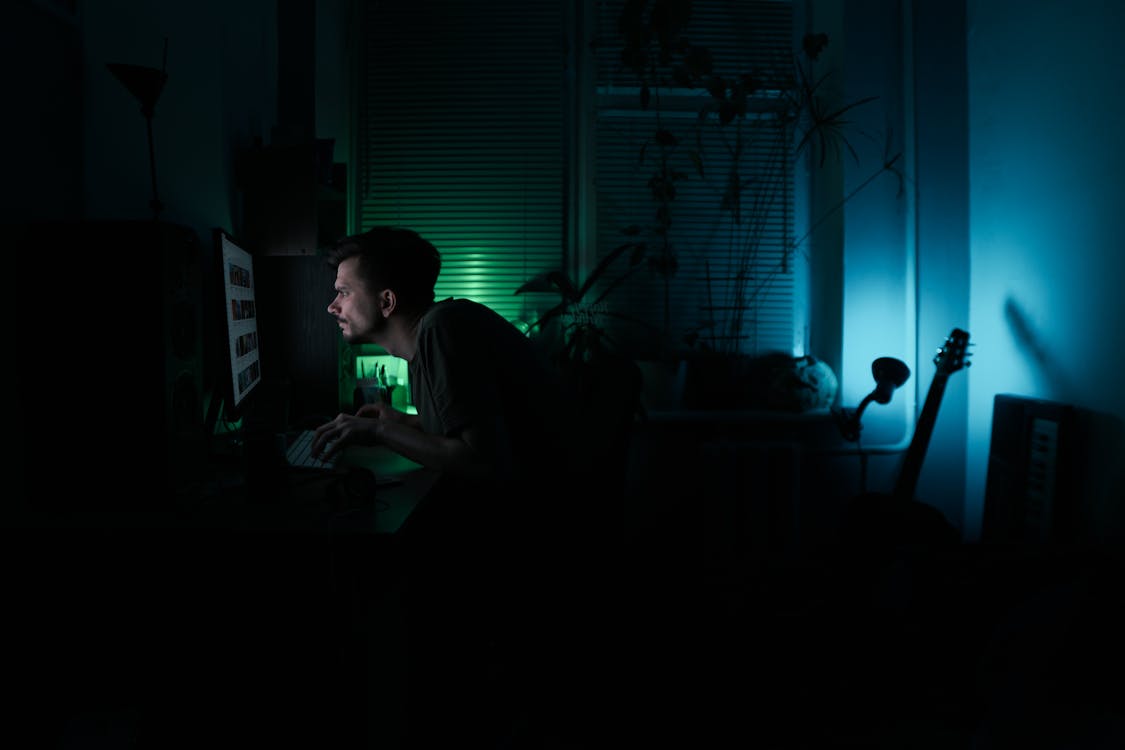 Free Man working at night at home Stock Photo