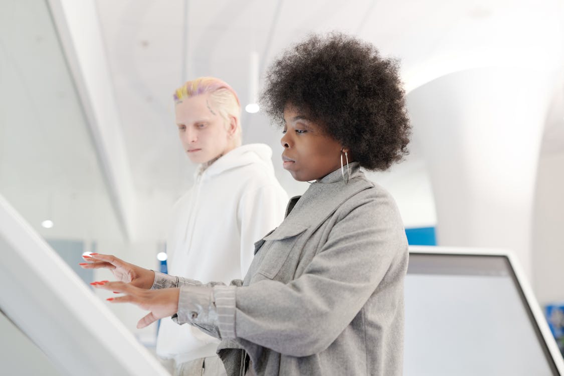 Side View of a Woman using a Touchscreen Device