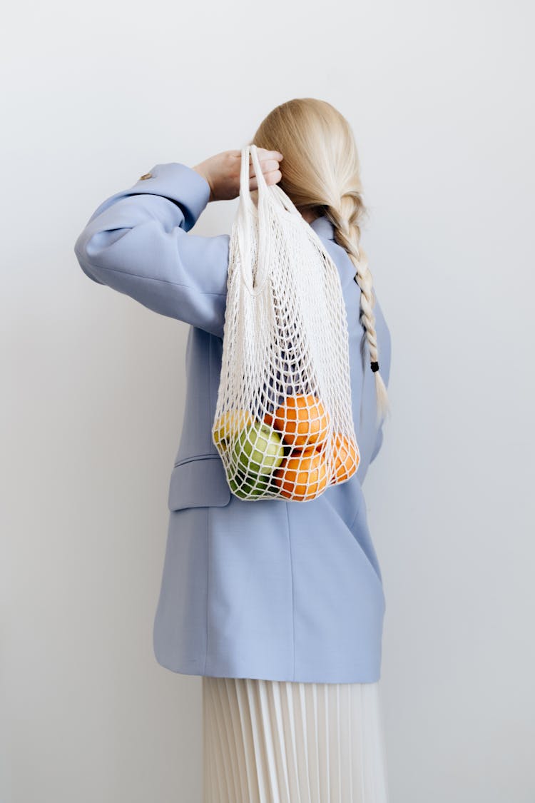 Woman With Bag Of Fruit