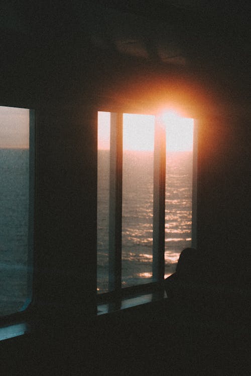 A View of the Ocean from inside a Ship during the Golden Hour