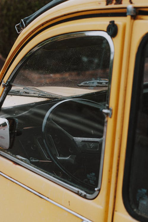 Steering wheel of yellow retro car