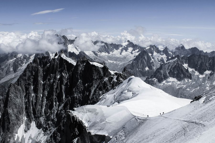 Climbers trekking on a frozen mountain slope