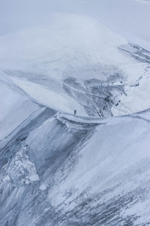 Snow Bound Ridge Distant alpinist walking along rough snowy mountain ridge · Free Stock ...