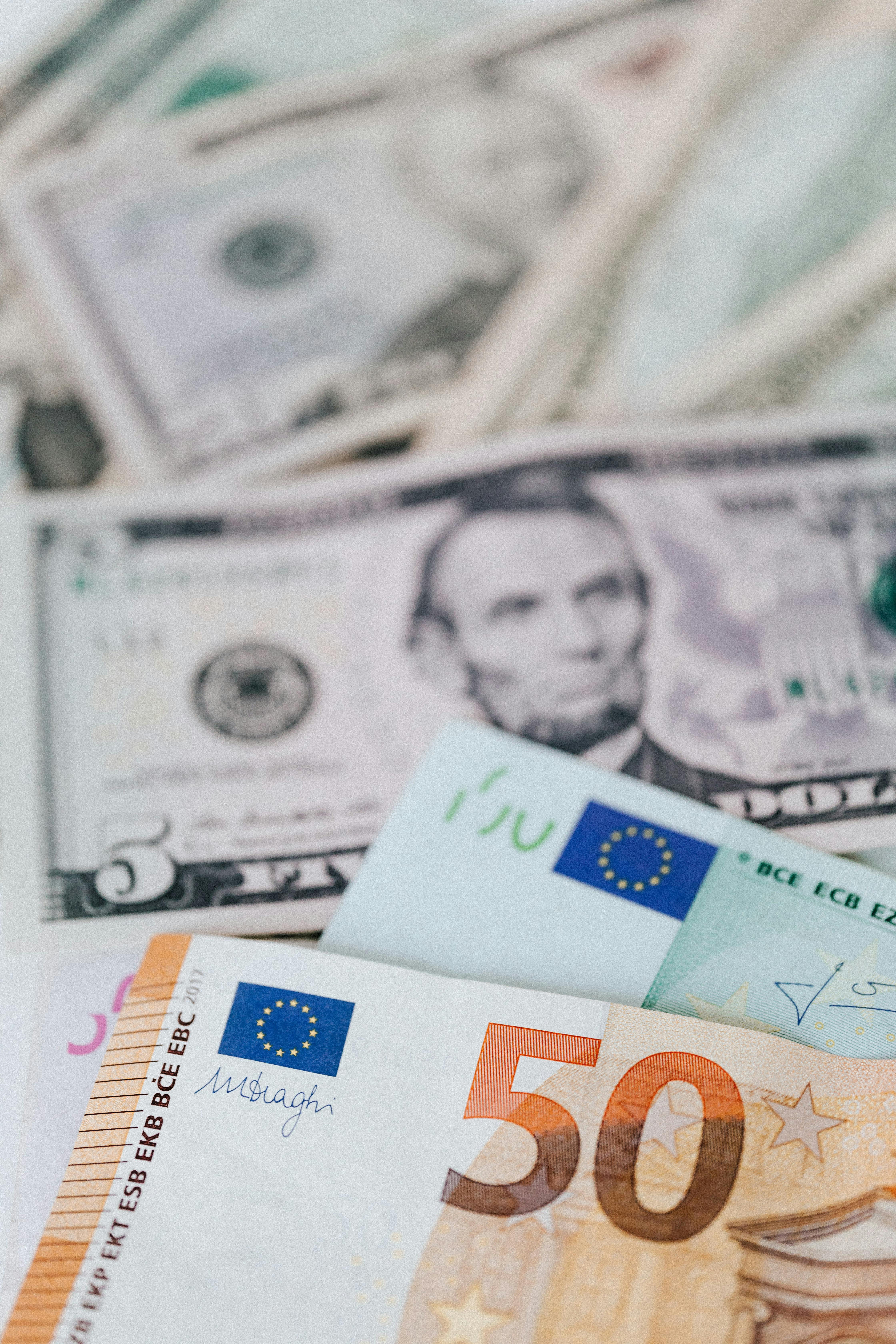 Cash money of dollar and euro banknotes \u00b7 Free Stock Photo