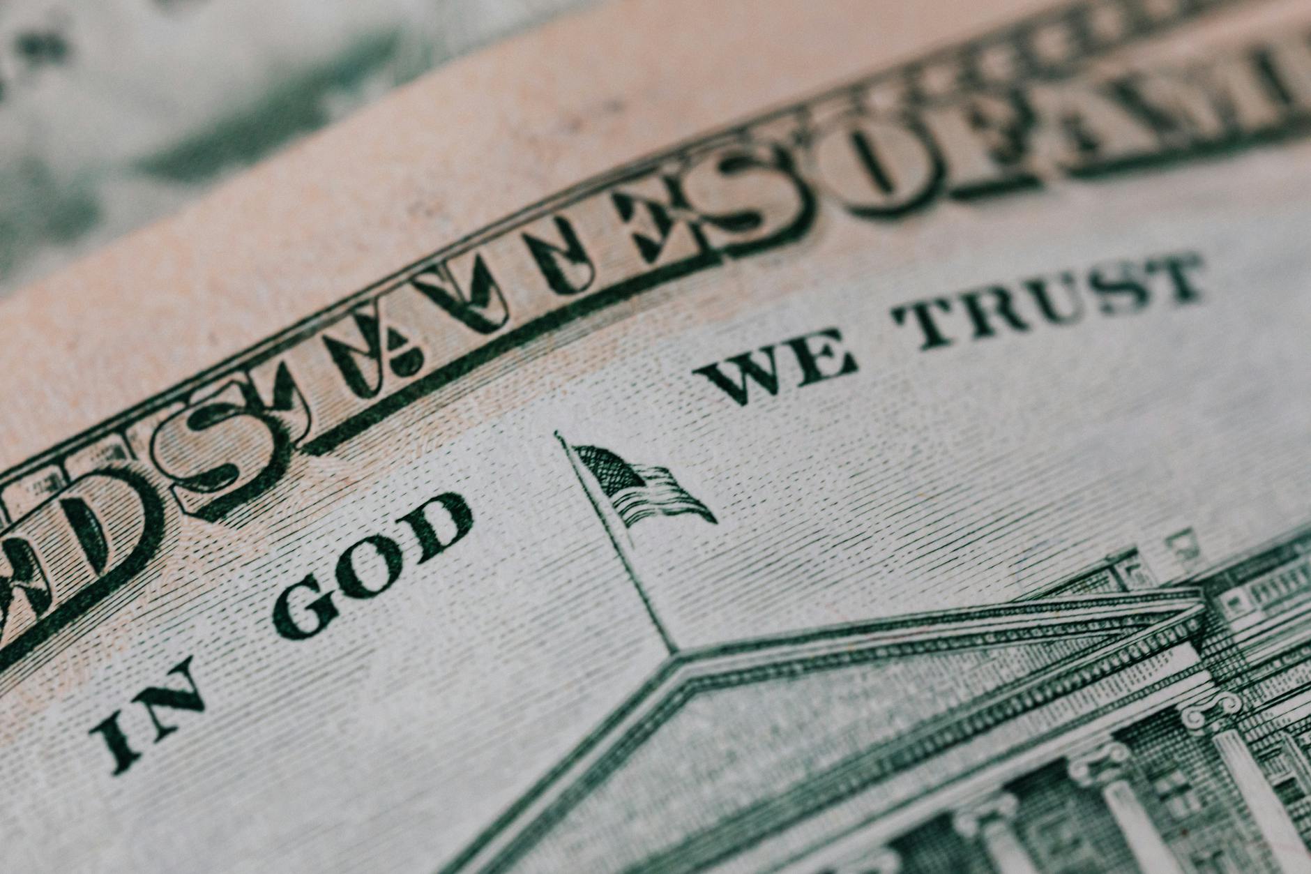 Closeup of ten dollar with inscription In God We Trust bill