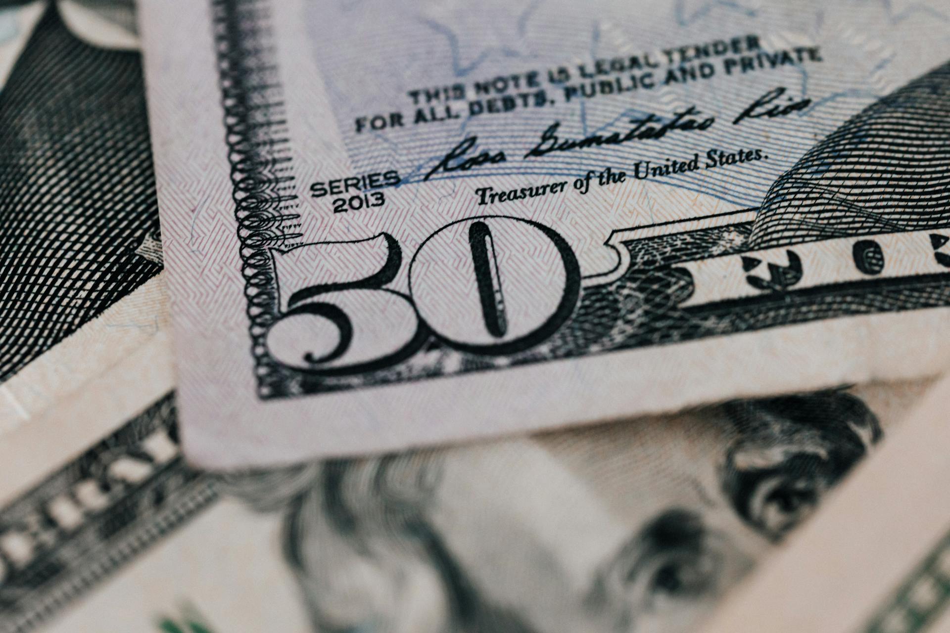 From above closeup of American dollar banknote with signature and printed words above paper money