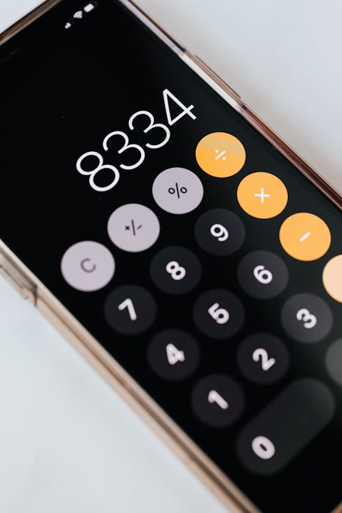Free Smartphone with calculator app showing total amount Stock Photo