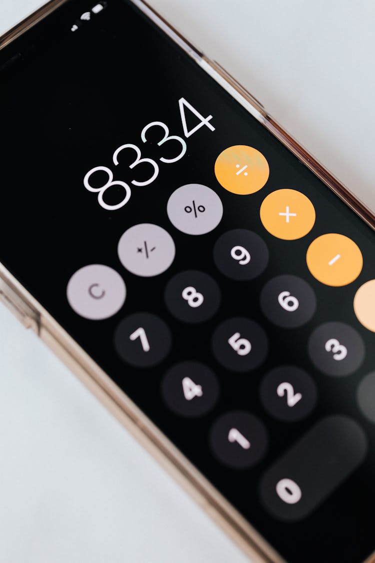 Smartphone With Calculator App Showing Total Amount