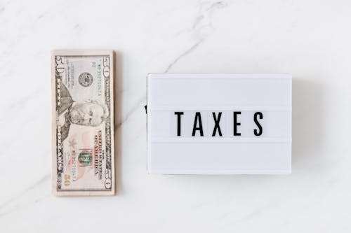 American dollar bills and vintage light box with inscription