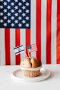 Tasty muffin with national flags of USA and Israel