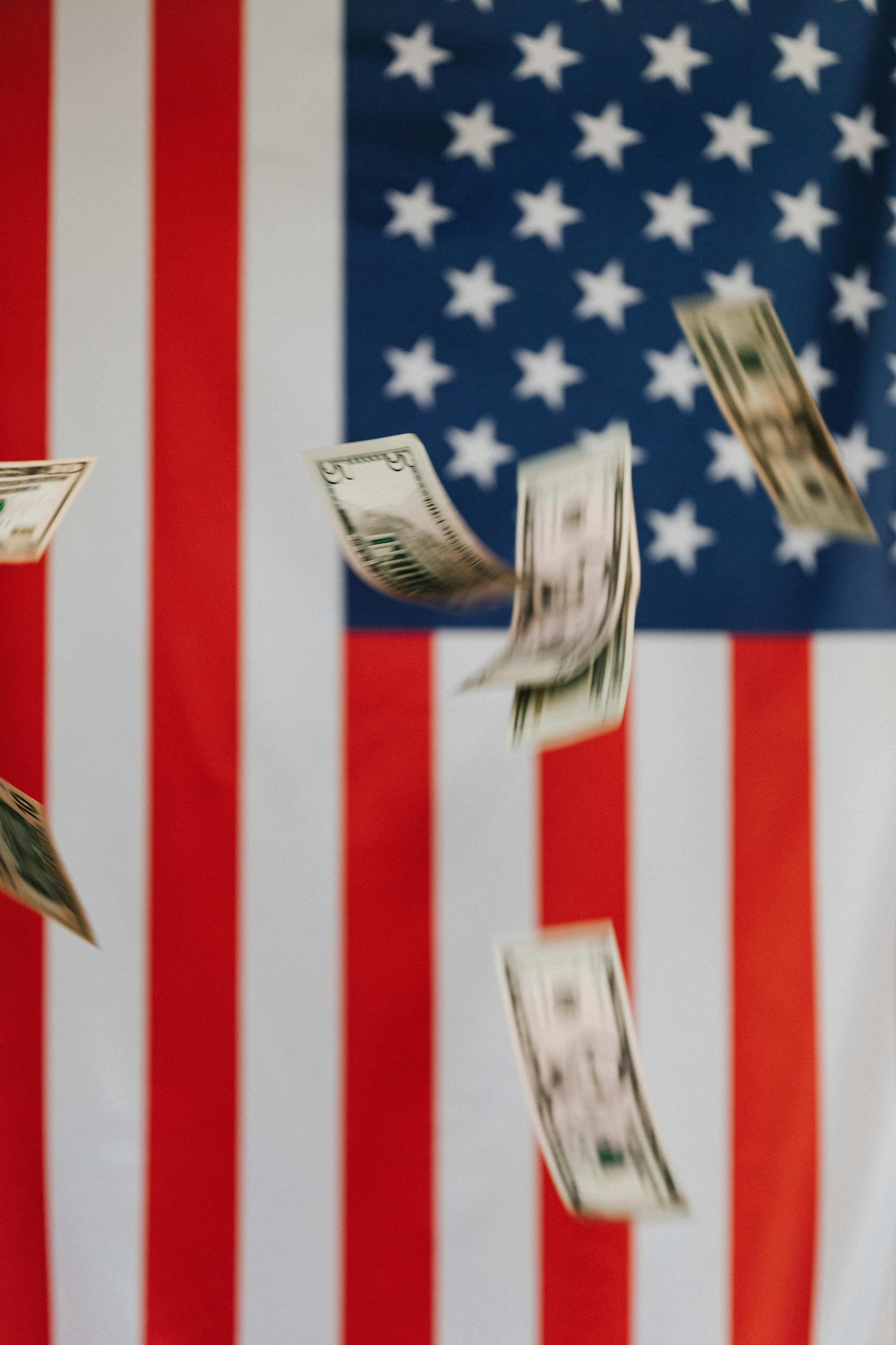american flag and money falling down