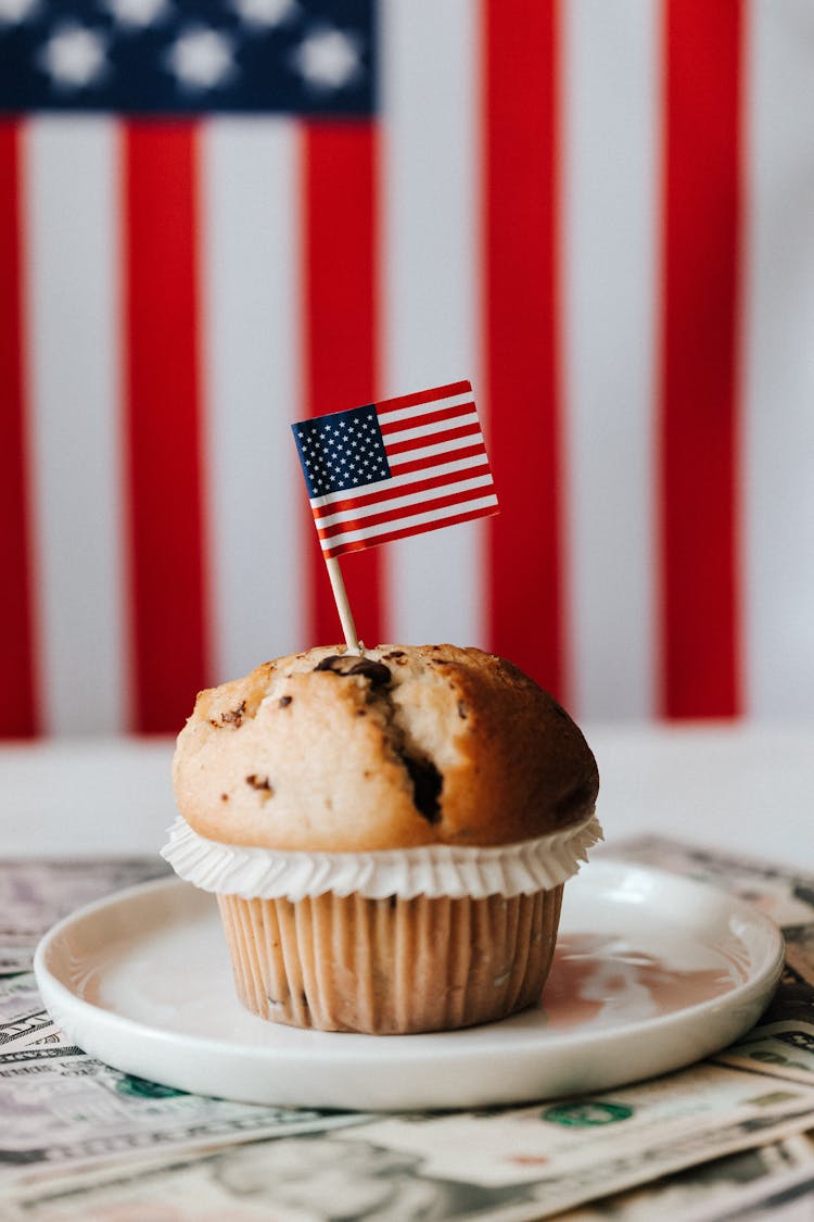 Dessert With Flag On Money Against American Flag On Background