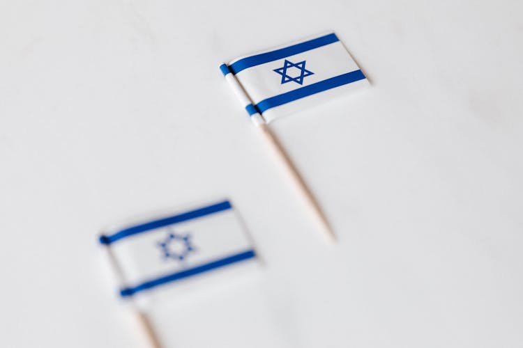 Israel Miniature Flag On White Surface