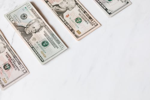 Set of various dollar banknotes on white table