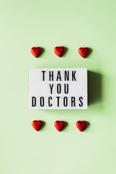 Lightbox with 'Thank You Doctors' message surrounded by red hearts on green background.