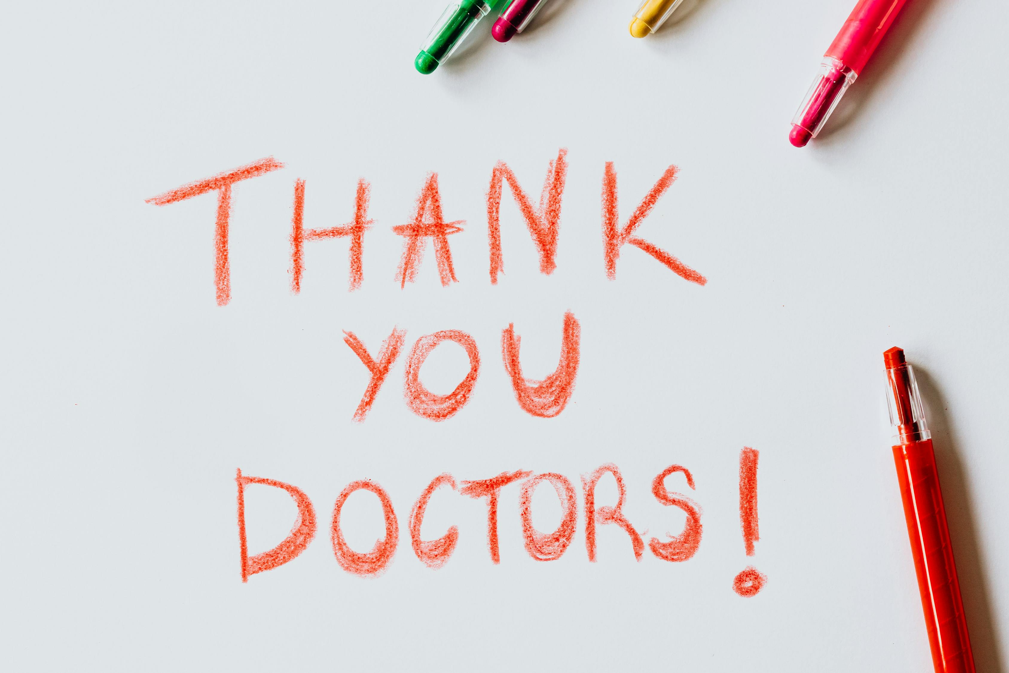 Thank You Doctors Written with red Colored Pencil