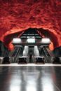 Man descending on escalator in modern underground
