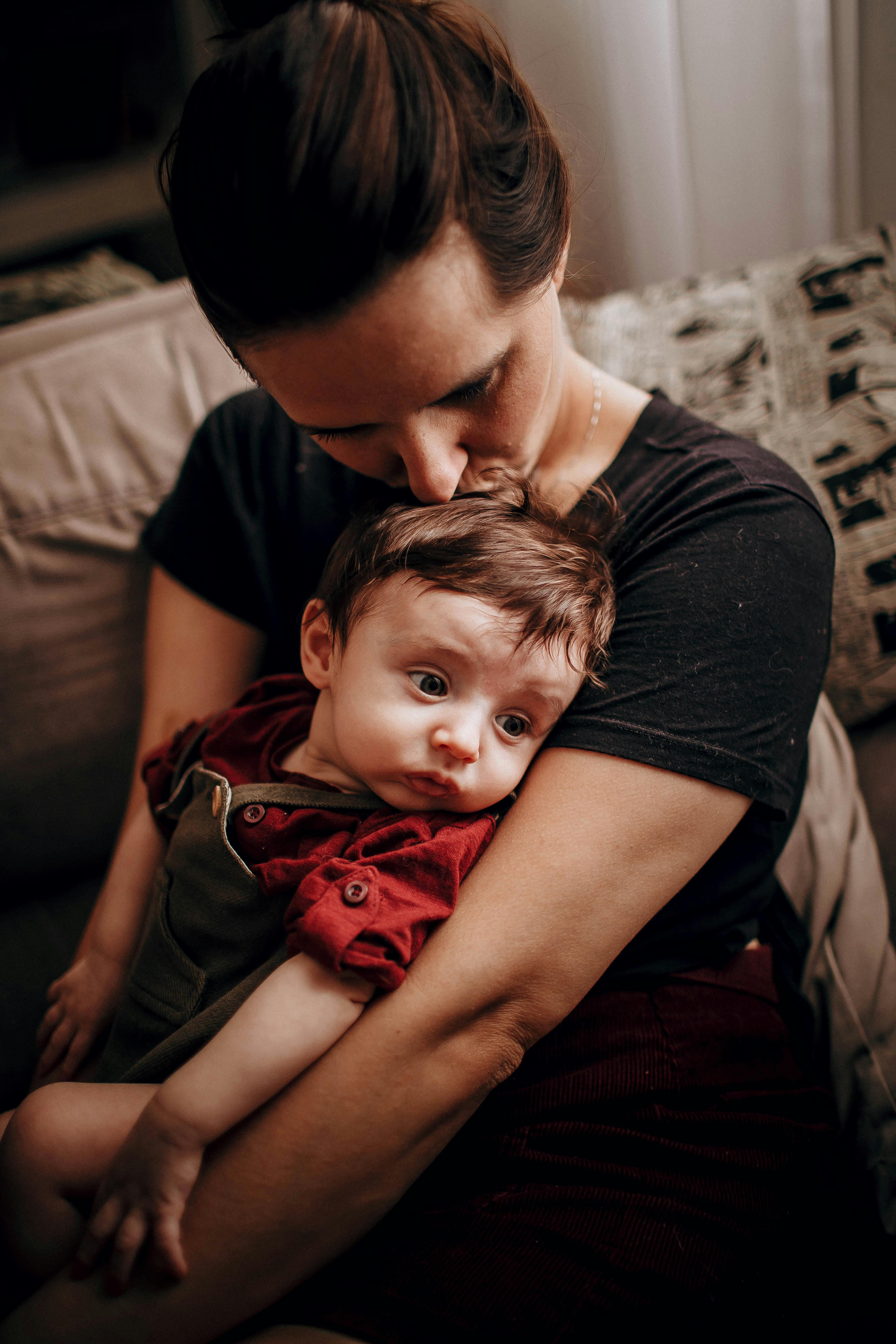 mother kissing her baby