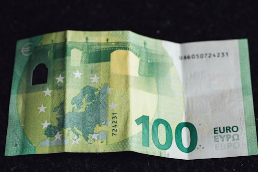 Close-up image of a 100 Euro banknote highlighting its design and details.