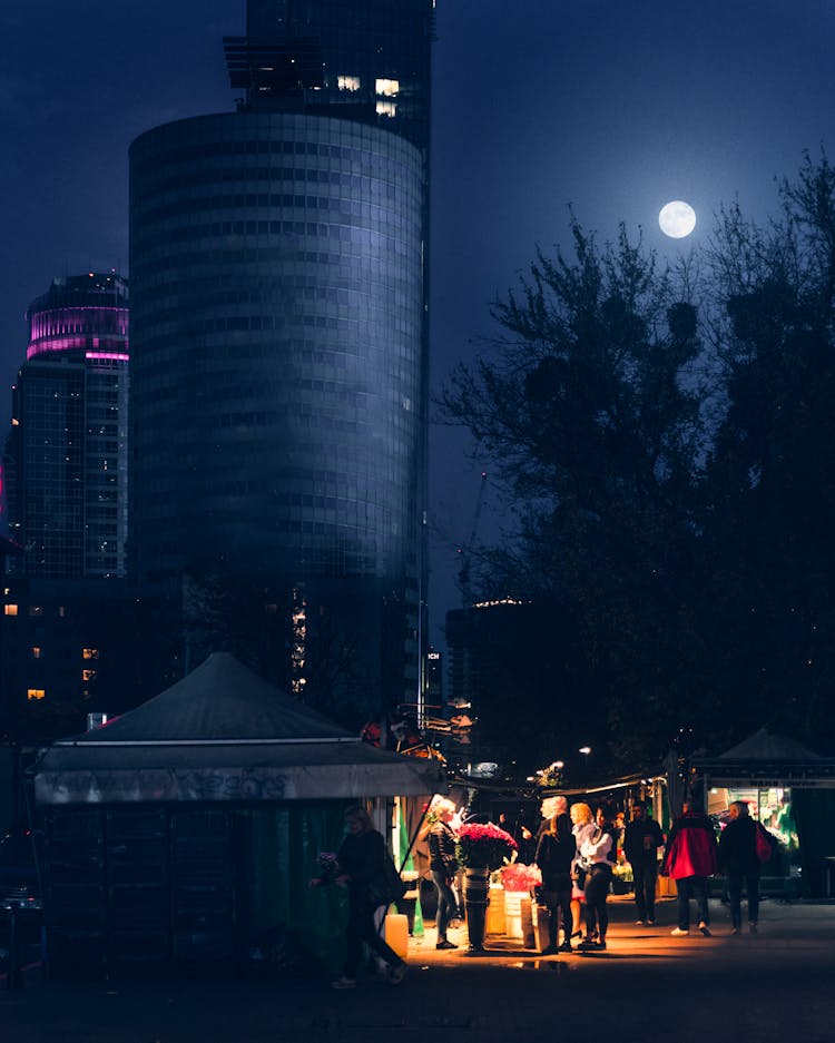 A Flower Shop Open In A City At Night