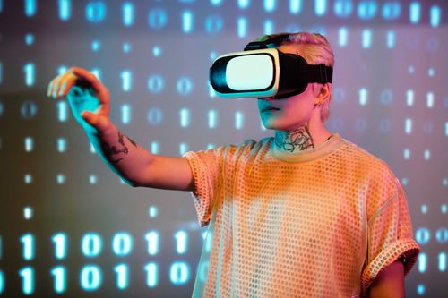 Person reaching out while wearing a virtual reality headset — Darlene Alderson on Pexels
