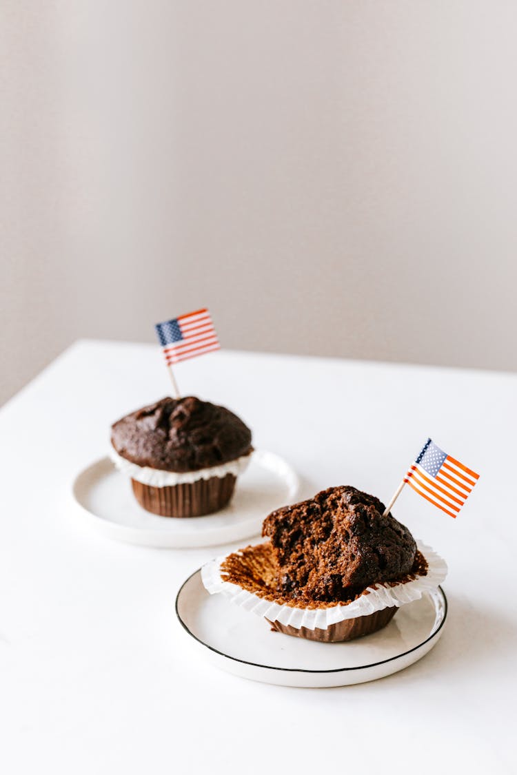 Tasty Festive Muffins Decorated With Cocktail Flags Of United States