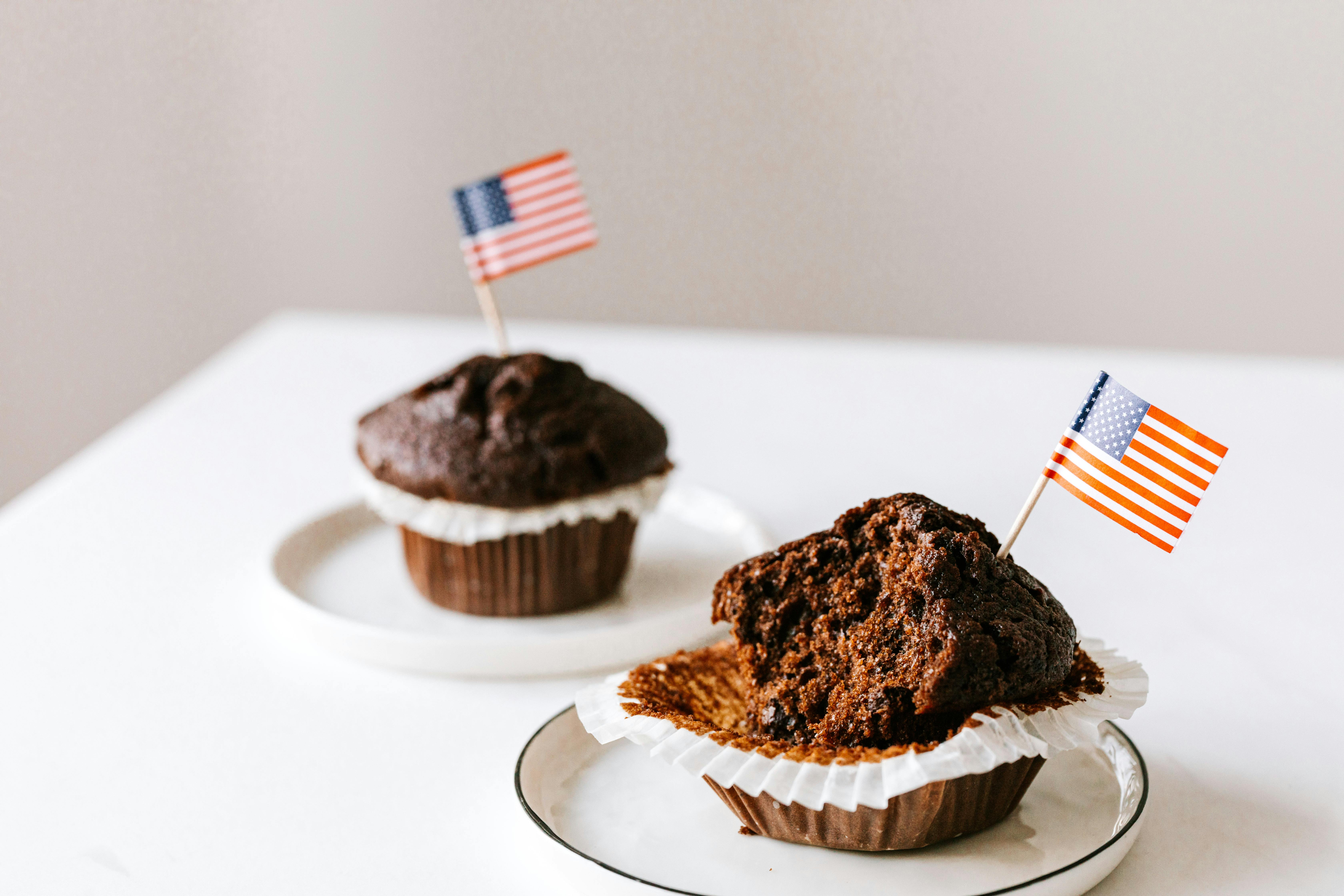 delicious sweet muffins decorated with toothpick flags of usa