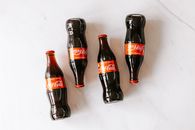 High angle composition of bottles of soft drink placed on white marble table