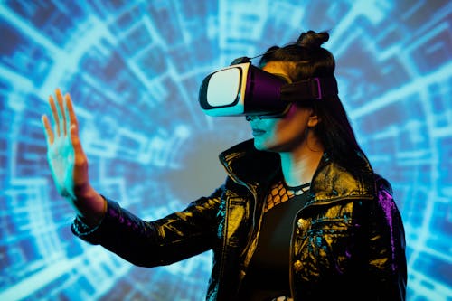 Free Woman in Black Leather Jacket Wearing Black and White Vr Goggles Stock Photo