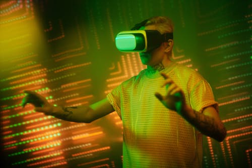 Man in Yellow Shirt Wearing Wearing VR Goggles