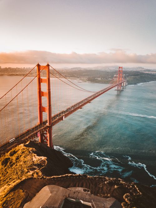 Free Breathtaking aerial shot of the iconic Golden Gate Bridge in San Francisco during sunset. Stock Photo