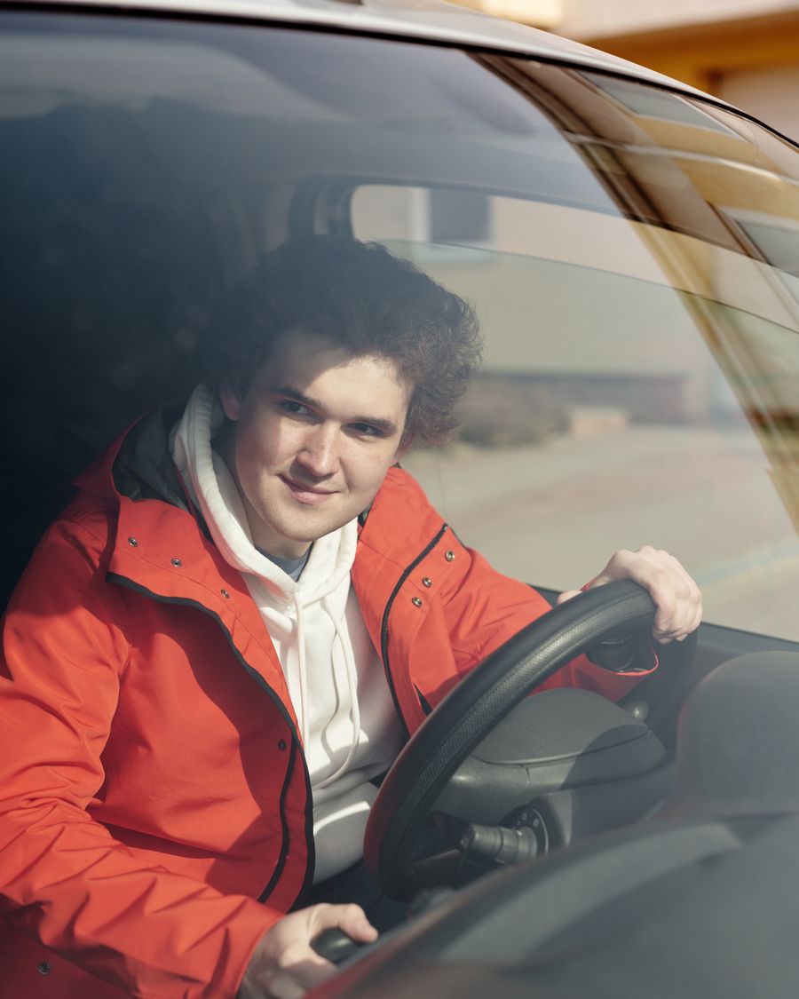 Tobias Reinders at the wheel, seen through the windscreen