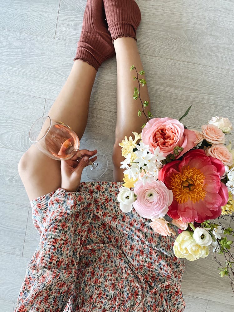 Crop Woman Drinking Wine While Resting At Home Near Gentle Flowers