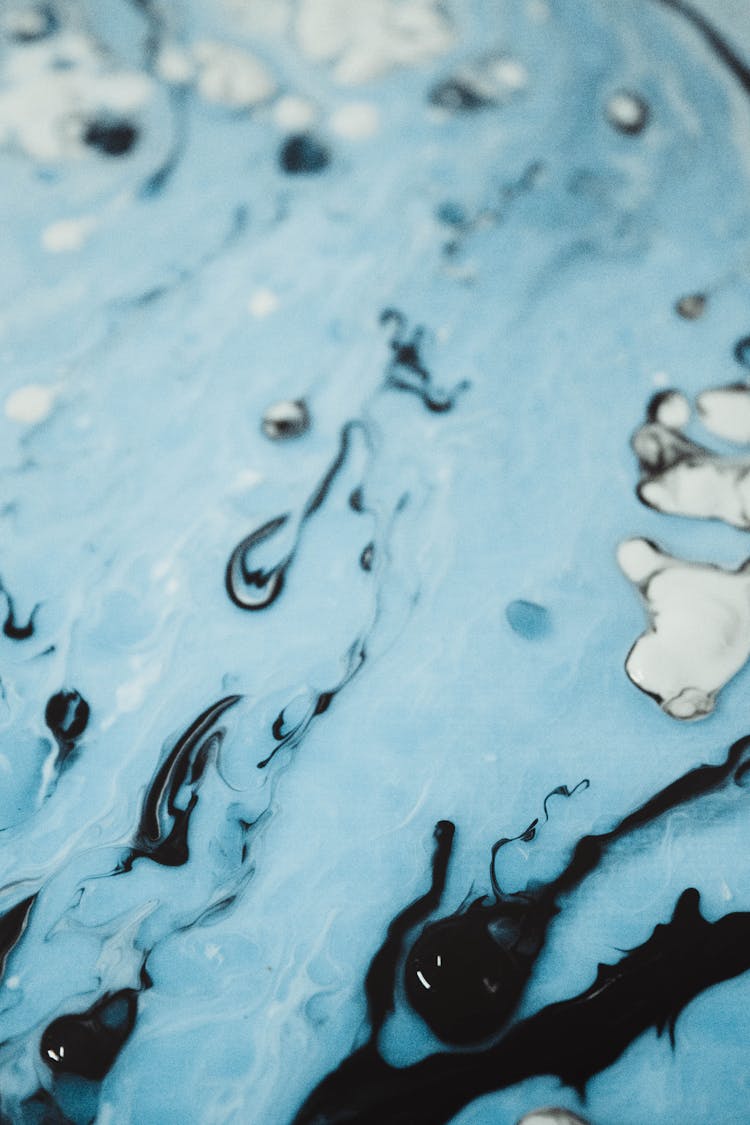 Abstract Light Blue Liquid Form With Black Drops