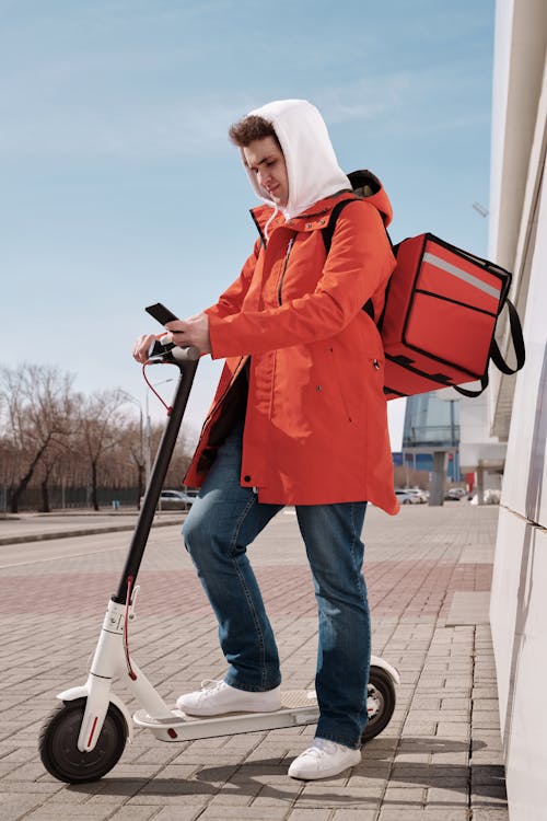 Delivery Man Checking his Smartphone