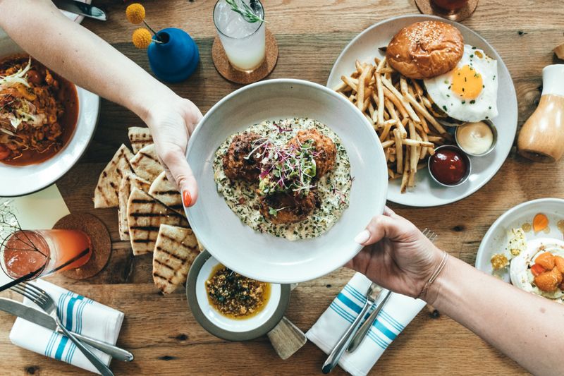 Overhead brunch spread of shared dishes — photo by Spencer Davis on Pexels