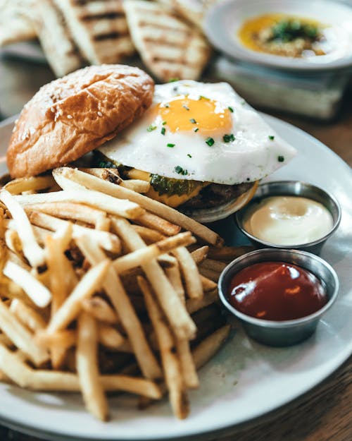 Burger and Fries on White Ceramic Plate